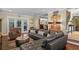 Comfortable living room with a modern leather sofa and hardwood flooring at 1621 Chippewa Trl, Maitland, FL 32751