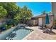 Inviting in-ground pool surrounded by brick pavers, lush landscaping, and a privacy fence for relaxing outdoor living at 1621 Chippewa Trl, Maitland, FL 32751