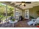 Beautiful screened porch featuring brick floors and lots of natural light at 1621 Chippewa Trl, Maitland, FL 32751