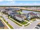 Aerial view of the neighborhood, highlighting the home's location near a lake at 1799 Tropical Palms Cir, Kissimmee, FL 34747