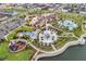 Expansive community pool area featuring multiple pools, playgrounds, and cabanas surrounded by lush greenery at 1799 Tropical Palms Cir, Kissimmee, FL 34747