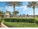 Welcome to Solara Resort! The beautiful sign is surrounded by lovely landscaping at 1799 Tropical Palms Cir, Kissimmee, FL 34747