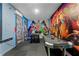The game room features comic character wall art, an air hockey table, and a foosball table at 1799 Tropical Palms Cir, Kissimmee, FL 34747