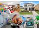 Collage showcasing a vibrant Toy Story-themed room, an exterior of a beautiful two-story home and a Moana themed room at 1799 Tropical Palms Cir, Kissimmee, FL 34747