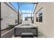 Hot Spring hot tub on the patio with a privacy screen and lush landscaping at 1799 Tropical Palms Cir, Kissimmee, FL 34747