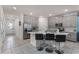 The kitchen features an island with barstool seating and stainless steel appliances at 1799 Tropical Palms Cir, Kissimmee, FL 34747
