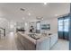 Bright, open living room featuring a large sectional sofa, tile flooring, recessed lighting, and neutral decor at 1799 Tropical Palms Cir, Kissimmee, FL 34747