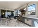 Outdoor kitchen with stainless steel appliances and large windows letting in natural light at 1799 Tropical Palms Cir, Kissimmee, FL 34747