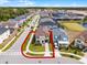 Beautiful two-story home with landscaped front yard and brick-paved walkway in a Gathering friendly neighborhood at 1799 Tropical Palms Cir, Kissimmee, FL 34747