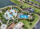 Aerial shot of Solara Resort's splash park featuring fun water slides and cabanas at 1799 Tropical Palms Cir, Kissimmee, FL 34747