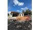 Exterior of home during the construction phase, showing block walls, framing, and an unfinished yard at 1803 Florinda Dr, Orlando, FL 32804