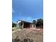 Exterior construction view of a block building with exposed framing, windows, and a portion of an outdoor patio at 1803 Florinda Dr, Orlando, FL 32804