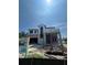 Modern home under construction features a unique design, large windows, and a spacious garage at 1803 Florinda Dr, Orlando, FL 32804