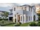 Beautiful two-story home with white brick facade, black trim, and manicured front yard at 1803 Florinda Dr, Orlando, FL 32804
