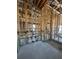 Interior view of the framing construction of a house with exposed beams and utilities at 1803 Florinda Dr, Orlando, FL 32804