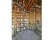 Exposed wood framing, concrete block walls, and stubbed out plumbing, showing the inner structure during construction at 1803 Florinda Dr, Orlando, FL 32804