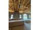 Interior view of new construction showing the ceiling, walls, and windows with construction materials inside at 1803 Florinda Dr, Orlando, FL 32804