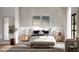 Serene primary bedroom with neutral tones, decorative art, and natural light at 1803 Florinda Dr, Orlando, FL 32804
