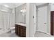 Bathroom featuring a shower-tub, granite vanity, and an adjacent closet, offering convenient storage at 193 Old Moss Cir, Deland, FL 32724
