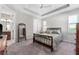 Comfortable bedroom featuring a ceiling fan, neutral color palette and bright windows at 193 Old Moss Cir, Deland, FL 32724
