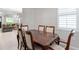 Dining room with a dining table, chairs; doorway leads to the living room at 193 Old Moss Cir, Deland, FL 32724