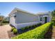 Side view of a charming one-story home featuring a two-car garage and landscaped yard at 193 Old Moss Cir, Deland, FL 32724