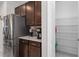 Kitchen area features stainless steel refrigerator, granite counters, and ample cabinet space and a pantry at 193 Old Moss Cir, Deland, FL 32724