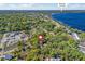 Stunning aerial view of the property near downtown Clermont and a beautiful blue lake at 208 Hideaway Ct, Minneola, FL 34715