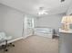 Bright bedroom with neutral walls, carpet flooring, ceiling fan and a daybed at 208 Hideaway Ct, Minneola, FL 34715