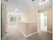 Upstairs hallway with carpet flooring, and plenty of natural light at 208 Hideaway Ct, Minneola, FL 34715