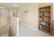 Upstairs hallway featuring carpeted floors, a built-in bookcase, and access to other rooms at 208 Hideaway Ct, Minneola, FL 34715