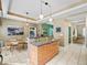 Kitchen features a breakfast bar with pendant lighting and views into the breakfast nook and hallway at 208 Hideaway Ct, Minneola, FL 34715
