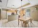 Eat-in kitchen featuring tile floors, wood cabinets, and stainless-steel appliances at 208 Hideaway Ct, Minneola, FL 34715