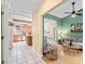 View from hall to living room with hardwood floors and green accent wall at 208 Hideaway Ct, Minneola, FL 34715