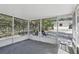 Screened-in back porch that is perfect for enjoying the outdoors in comfort and privacy at 211 Agua Vista St, Debary, FL 32713