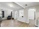 Spacious living room with lots of natural light, wood-look tile floor and neutral paint at 211 Agua Vista St, Debary, FL 32713