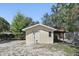 A small storage shed with covered area is situated in the backyard of the property at 211 Agua Vista St, Debary, FL 32713