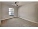 Bedroom featuring carpeted floors, ceiling fan, and a window that provides ample light at 213 Almaden Ct, Winter Springs, FL 32708