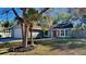 Charming single Gathering home with manicured landscaping and a vibrant red front door at 213 Almaden Ct, Winter Springs, FL 32708