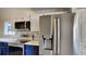 Kitchen features stainless steel appliances, modern cabinetry, and stylish backsplash at 213 Almaden Ct, Winter Springs, FL 32708