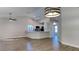Spacious living room with a view of the kitchen and a breakfast bar seating area at 213 Almaden Ct, Winter Springs, FL 32708