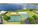 Aerial view of community amenities including lakes, tennis courts, and hockey rink at 2359 Baronsmede Ct, Winter Garden, FL 34787