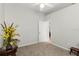 Bright bedroom features neutral tones, carpet, ceiling fan and an open doorway at 2359 Baronsmede Ct, Winter Garden, FL 34787