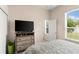 Bright bedroom with natural light and a large dresser at 2359 Baronsmede Ct, Winter Garden, FL 34787