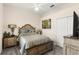 Bedroom with a queen bed, and decorative wooden furniture at 2359 Baronsmede Ct, Winter Garden, FL 34787