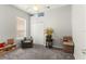 Bedroom with a ceiling fan, chair, and overhead storage at 2359 Baronsmede Ct, Winter Garden, FL 34787