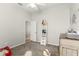bedroom with ladder shelf, dresser, and neutral paint at 2359 Baronsmede Ct, Winter Garden, FL 34787