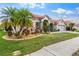 Beautiful single-story home featuring mature palm trees, well-manicured lawn, and a paver driveway at 2359 Baronsmede Ct, Winter Garden, FL 34787
