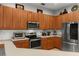 Well-maintained kitchen with stainless steel appliances, ample cabinet space, and light countertops at 2359 Baronsmede Ct, Winter Garden, FL 34787