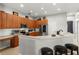Spacious kitchen with stainless steel appliances, light countertops, breakfast bar, and ample cabinet space at 2359 Baronsmede Ct, Winter Garden, FL 34787